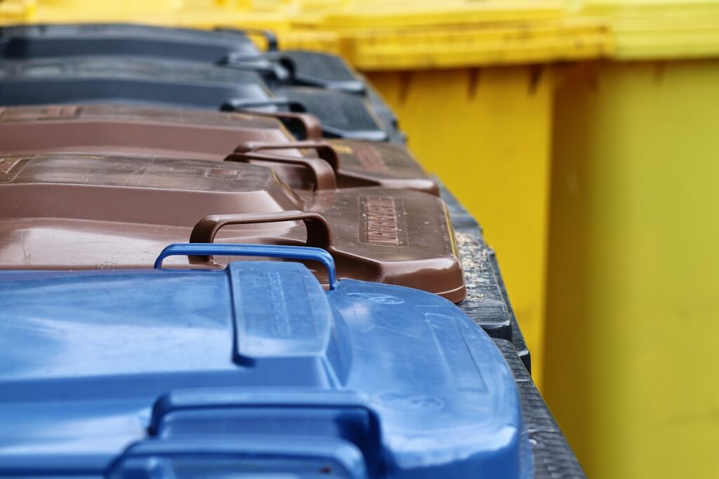 A row of rubbish bins.